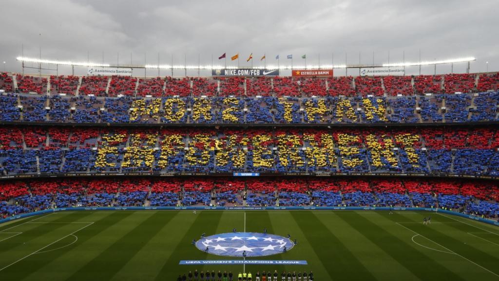 Supporters hold up banners reading "More than empowerment" before the Women's Champions League quarter final, second leg soccer match between Barcelona and Real Madrid at Camp Nou stadium in Barcelona, Spain, Wednesday, March 30, 2022. (AP Photo/Joan Monfort)